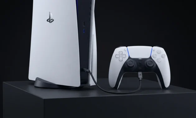 PS5 DualSense controller plugged into PlayStation 5 console using USB-C cable for wired connection